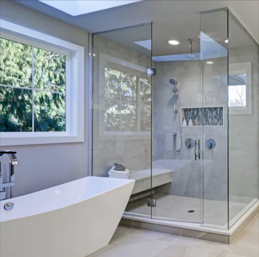 Spa bathroom with freestanding tub and frameless shower - bathroom renovation Naples FL