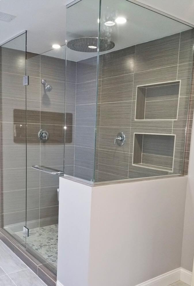 Modern walk-in shower with rain head and built-in niches - Southwest Florida bathroom contractor