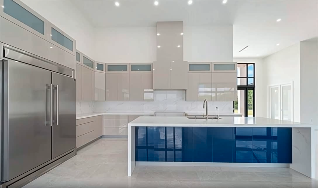 Modern kitchen with blue island and high ceilings - custom kitchen Naples FL