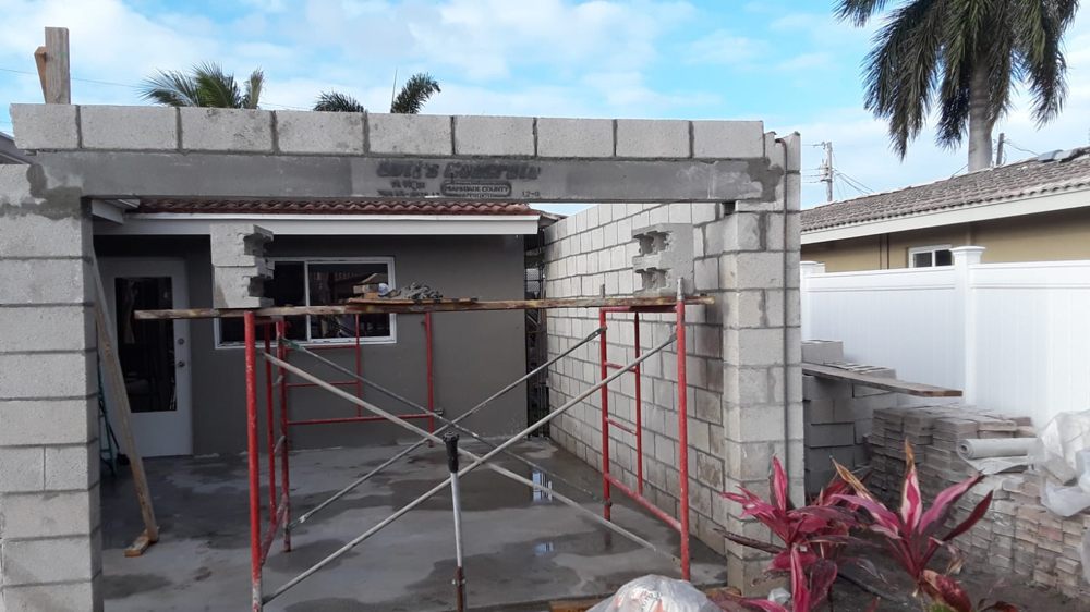 Room addition concrete block walls under construction - structural framing Southwest Florida