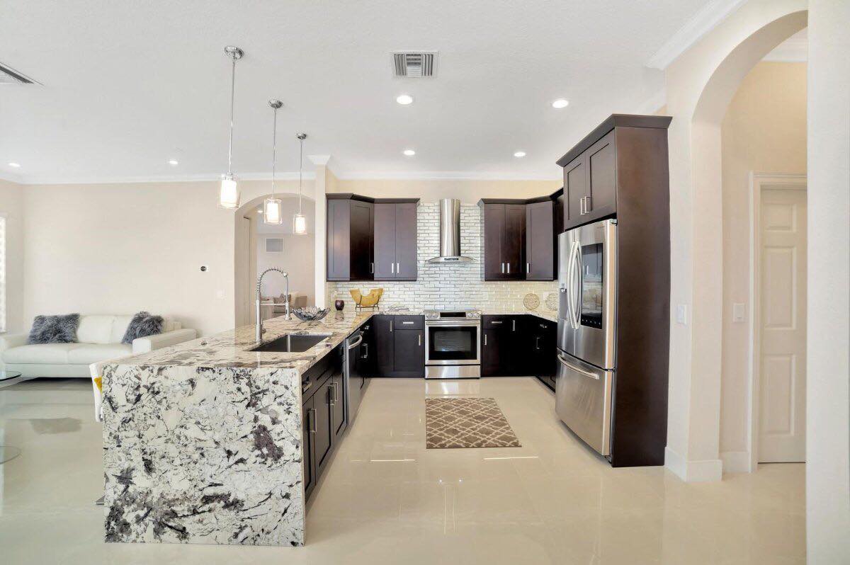 Contemporary open kitchen remodel with dark wood cabinets Southwest Florida